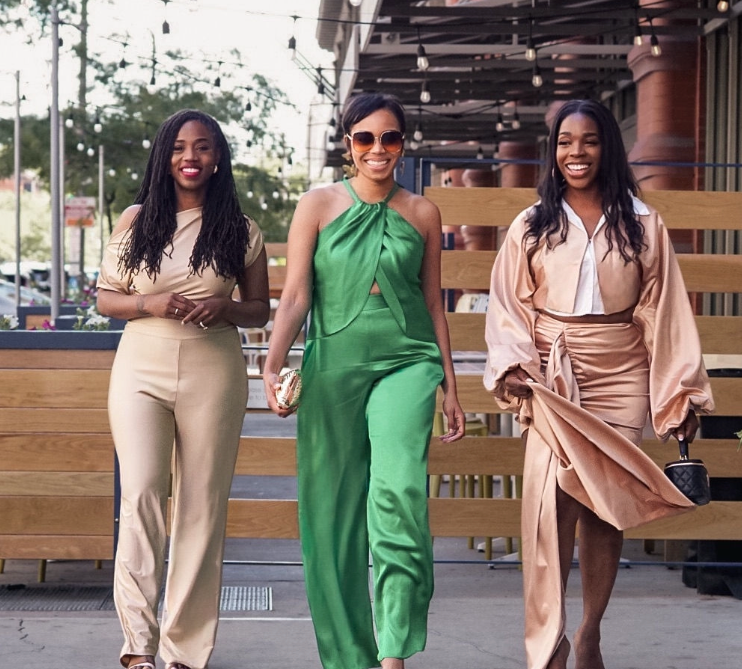 Kodi Pride, Paris Lampkins, and Niyia L. Whitsett walking together